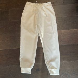 Off white dress slacks, modern look with elastic/drawstring waist and cuffs. XS